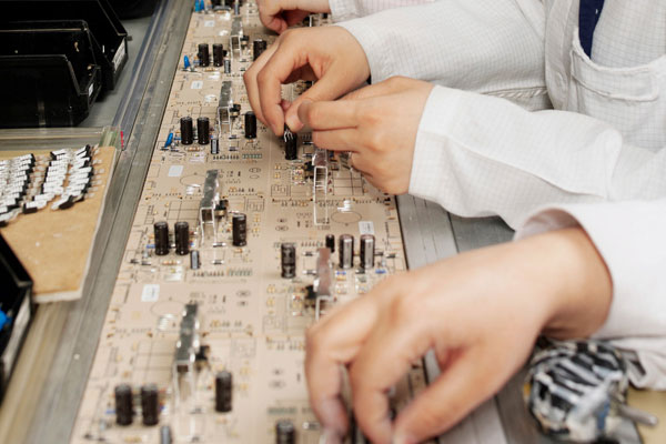 Team of staff working on production line