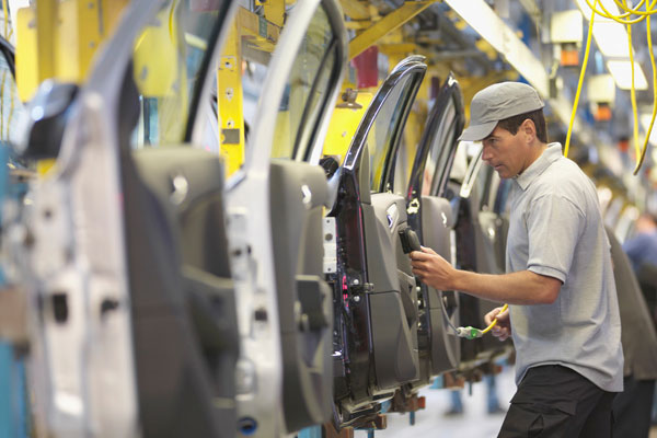 Car doors being manufactured